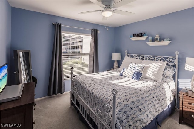 bedroom with ceiling fan and carpet floors