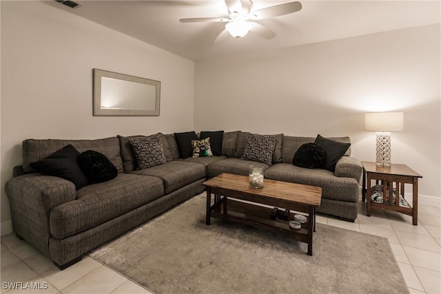 living room featuring ceiling fan and light tile patterned floors