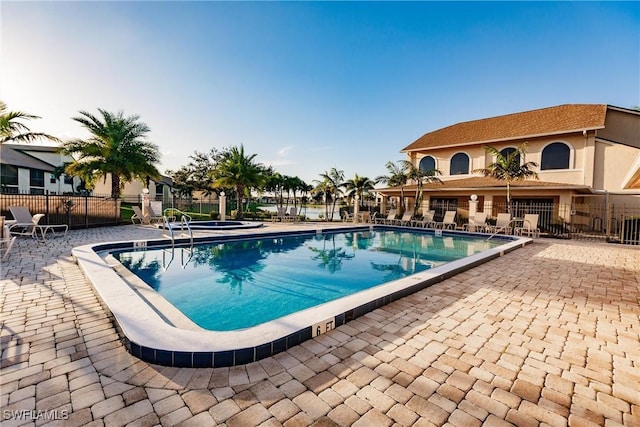 view of swimming pool with a patio area