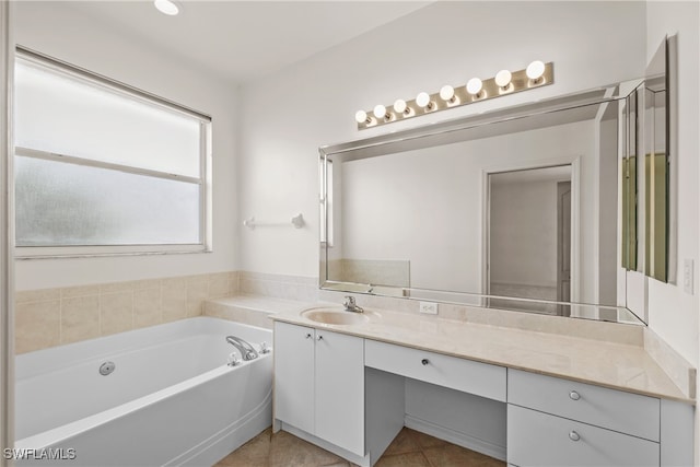 bathroom with tile patterned flooring, vanity, and a tub to relax in