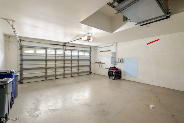 garage featuring a garage door opener and electric panel