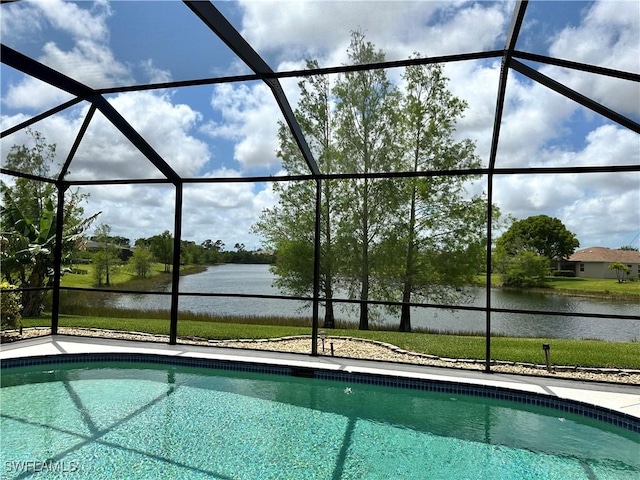 view of pool featuring a lanai and a water view