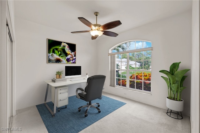 office area featuring ceiling fan and light colored carpet