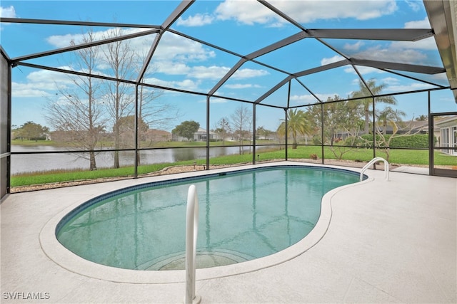 view of swimming pool featuring a patio, a water view, glass enclosure, and a lawn