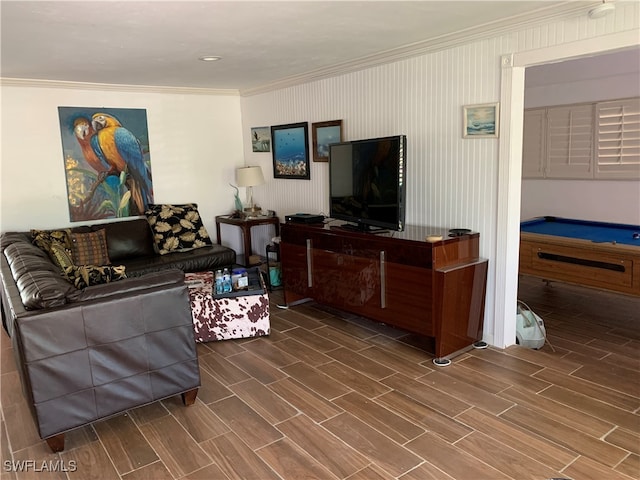 living room with pool table, ornamental molding, and hardwood / wood-style flooring