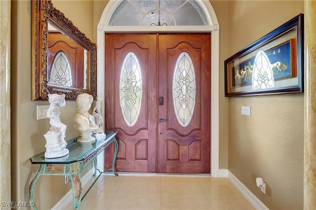 foyer with light tile patterned flooring