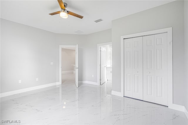 unfurnished bedroom with a closet and ceiling fan