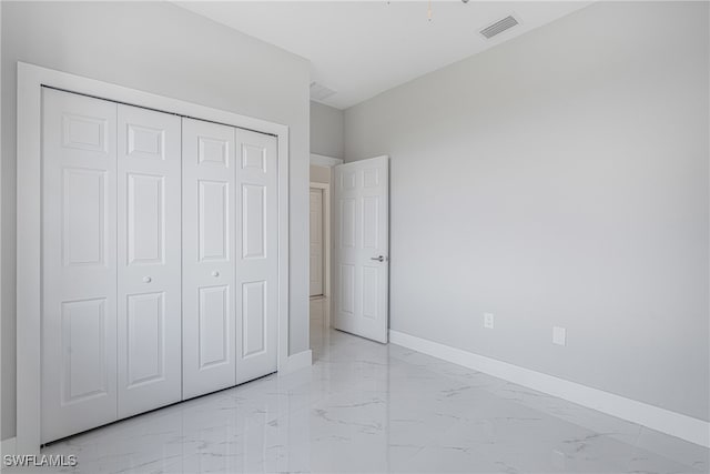 unfurnished bedroom featuring a closet