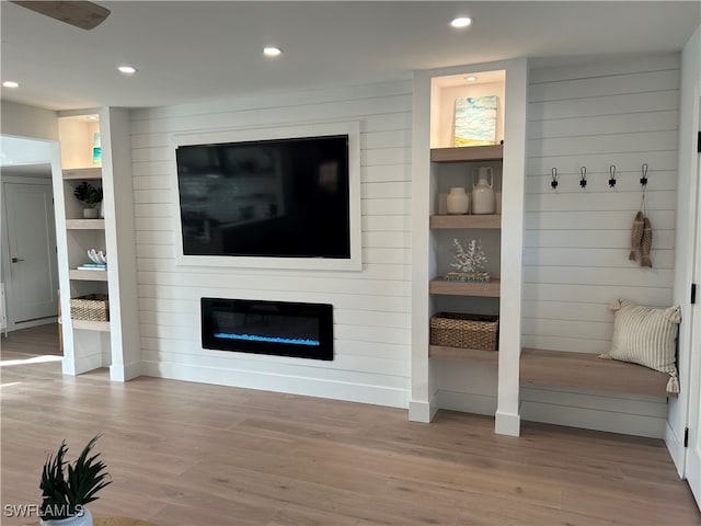 living room featuring a fireplace and hardwood / wood-style flooring