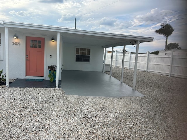 view of front of home featuring a carport