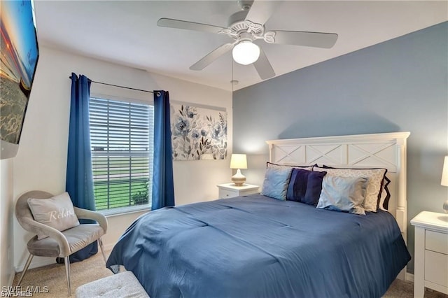 bedroom featuring light carpet and ceiling fan