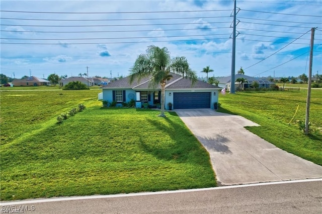 view of front of property with a garage and a front lawn