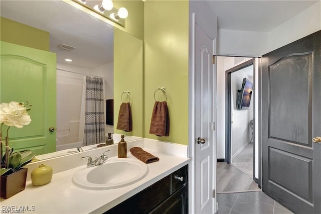 bathroom featuring tile patterned floors and vanity