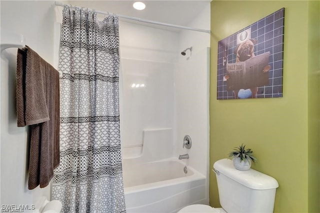 bathroom with toilet and shower / bath combination with curtain