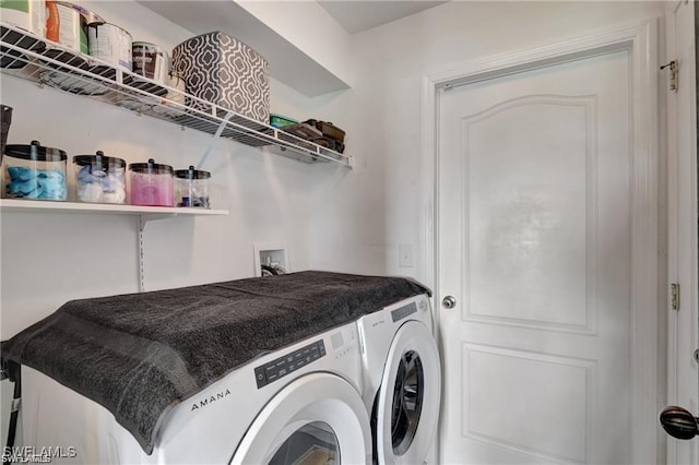 laundry area with washing machine and dryer