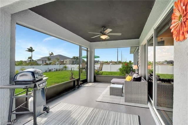 sunroom / solarium with ceiling fan