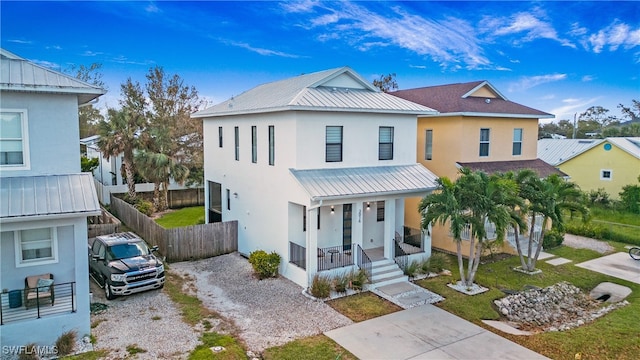 view of front facade featuring a front lawn and a porch