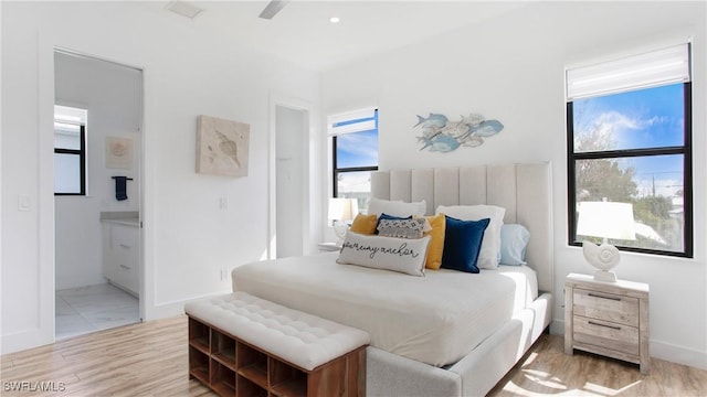 3016 Van Buren Ave, Naples, FL 34112 - bedroom with baseboards, connected bathroom, and wood finished floors