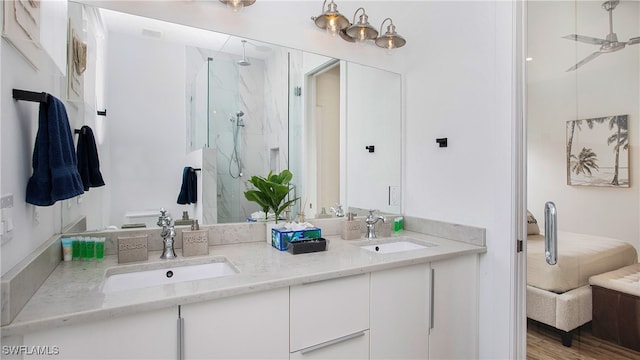 bathroom featuring a shower with door, vanity, and wood-type flooring