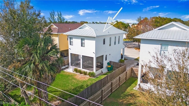 3016 Van Buren Ave, Naples, FL 34112 - rear view of house featuring stucco siding, a sunroom, and metal roof