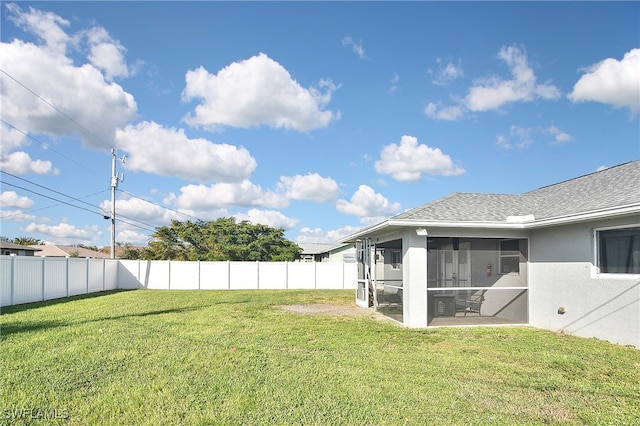 view of yard featuring a sunroom