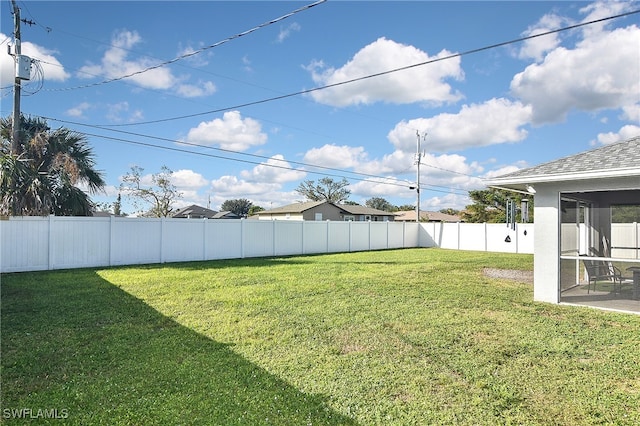 view of yard with a sunroom