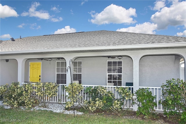 exterior space featuring ceiling fan and a porch