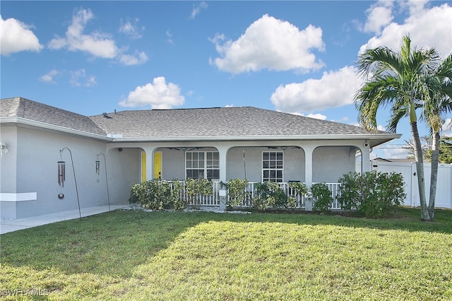 view of front of home featuring covered porch and a front lawn