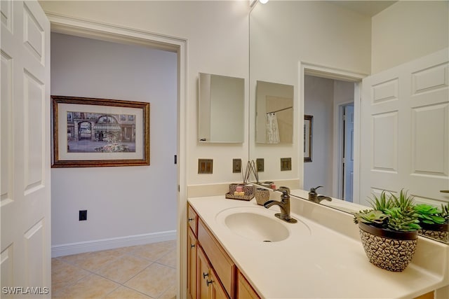 bathroom featuring vanity and tile patterned flooring