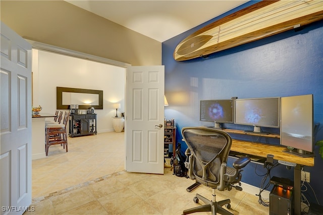 home office with tile patterned flooring