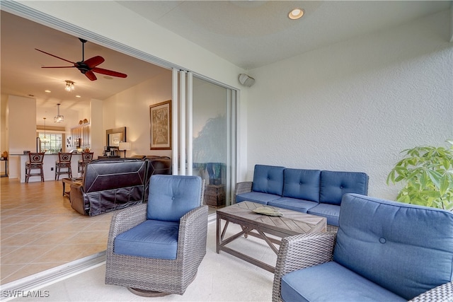 exterior space with an outdoor hangout area and ceiling fan