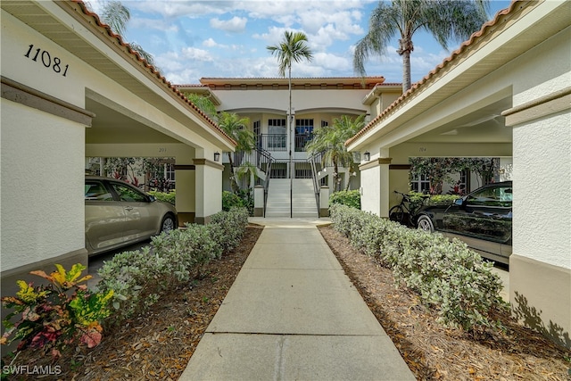 property entrance with a carport