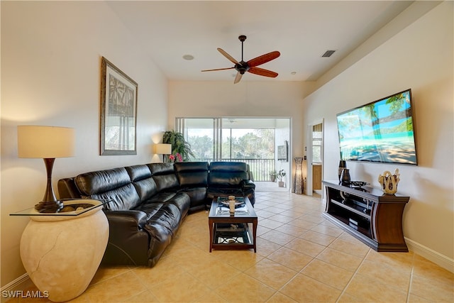 tiled living room featuring ceiling fan