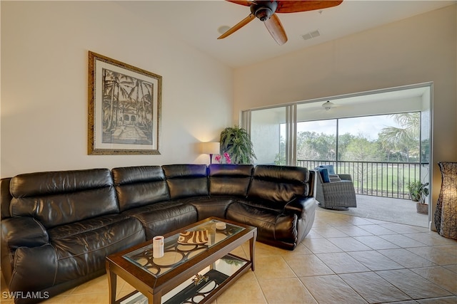 tiled living room featuring ceiling fan