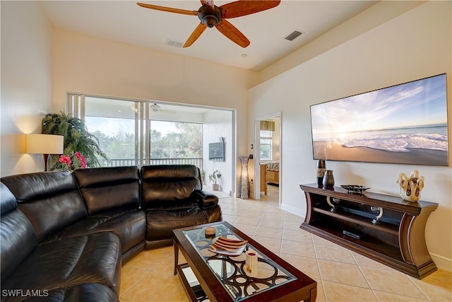 tiled living room featuring ceiling fan