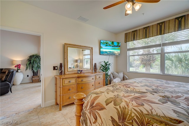 bedroom featuring light tile patterned floors and ceiling fan