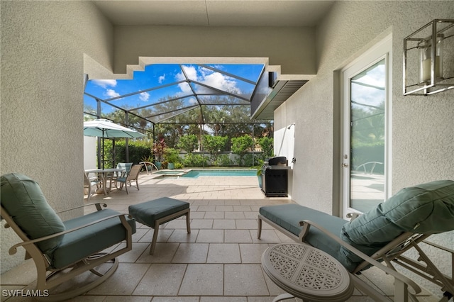 view of patio / terrace with glass enclosure