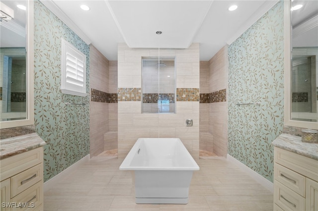 bathroom with vanity, crown molding, and separate shower and tub