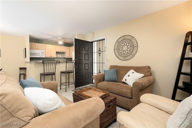 living room with ceiling fan and light tile patterned flooring