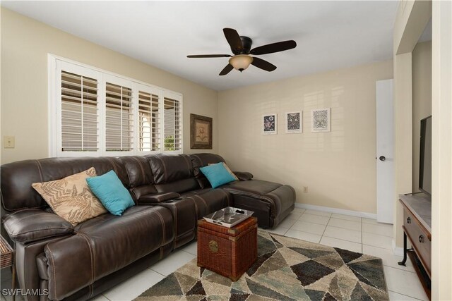 living room with light tile patterned floors and ceiling fan