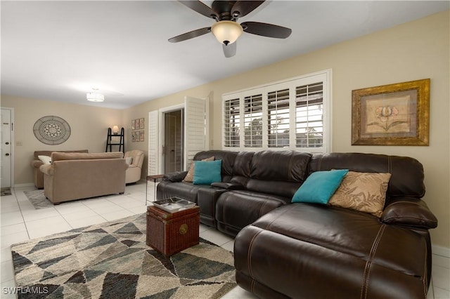 living room featuring ceiling fan and light tile patterned floors