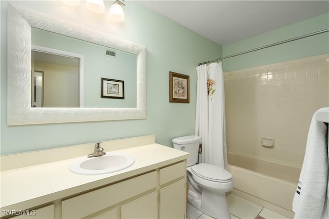 full bathroom with tile patterned flooring, vanity, shower / tub combo, and toilet