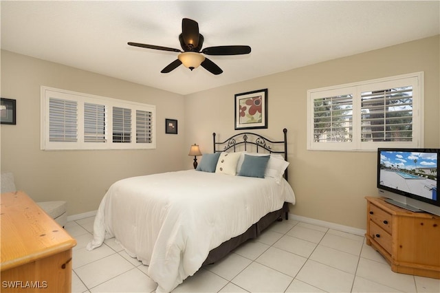 bedroom with ceiling fan and light tile patterned floors