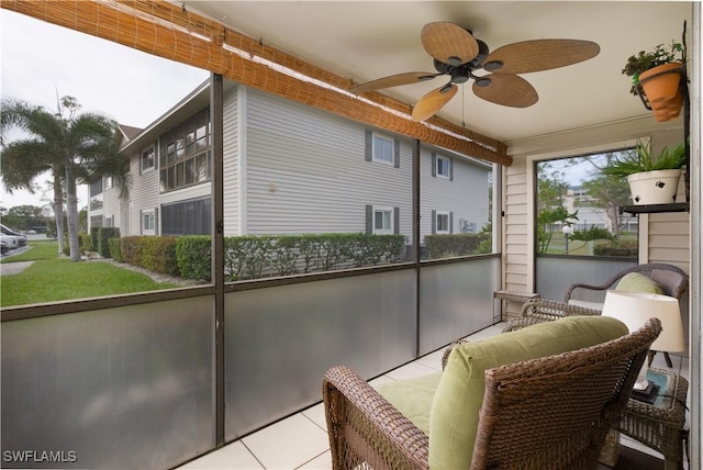 sunroom / solarium featuring ceiling fan