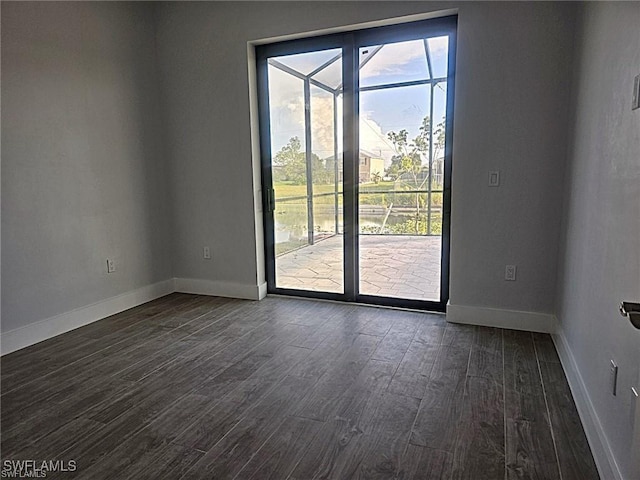 empty room with dark hardwood / wood-style floors