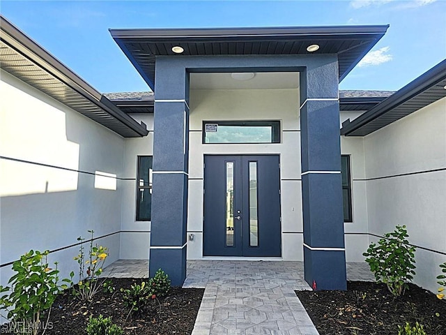 property entrance featuring french doors