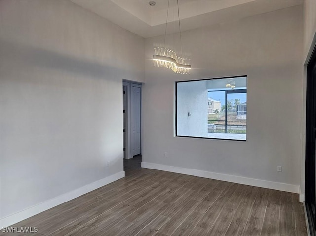 unfurnished room with hardwood / wood-style flooring