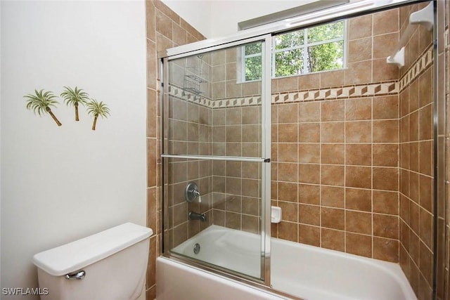 8921 Crown Colony Blvd, Fort Myers, FL 33908 - bathroom featuring toilet and shower / bath combination with glass door