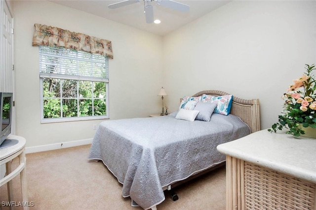 carpeted bedroom with ceiling fan