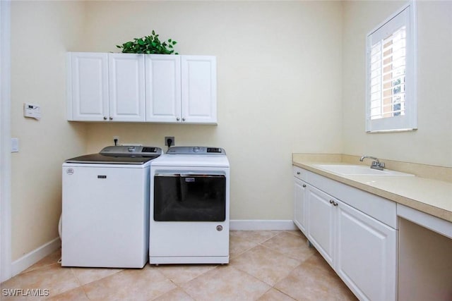 8921 Crown Colony Blvd, Fort Myers, FL 33908 - laundry area with washer and clothes dryer, cabinet space, baseboards, and light tile patterned floors